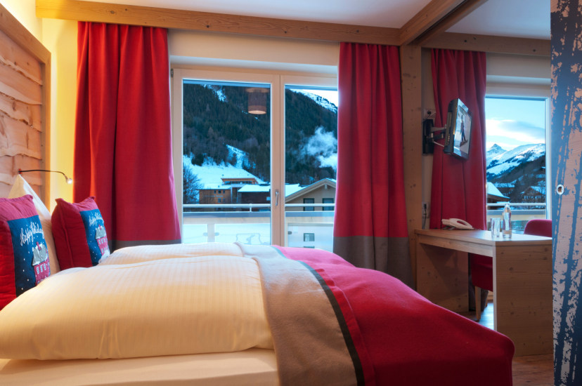 Großzügige Zimmer & Suiten mit traumhaftem Blick in die Salzburger Alpenwelt.